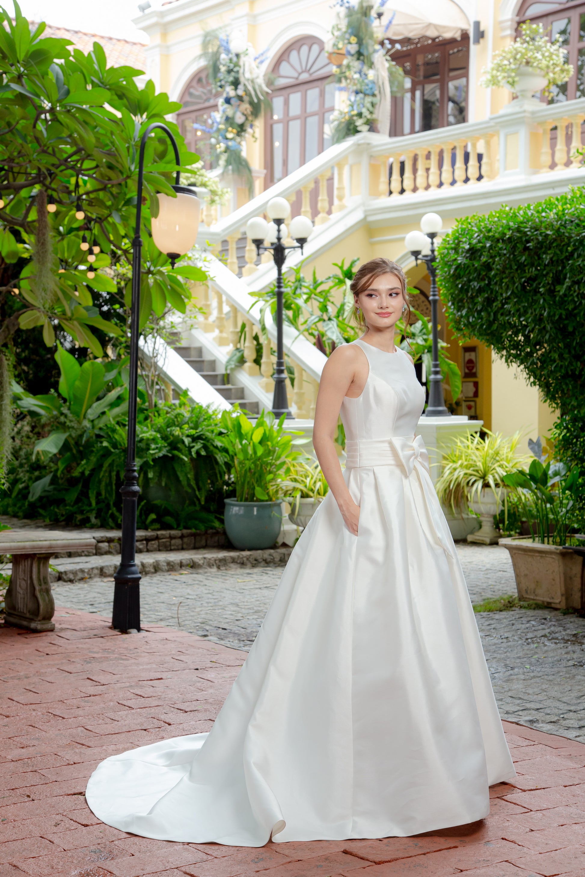 Minimalist Mikado A-Line Wedding Gown with Sculpted Bow | Briderful - side detail