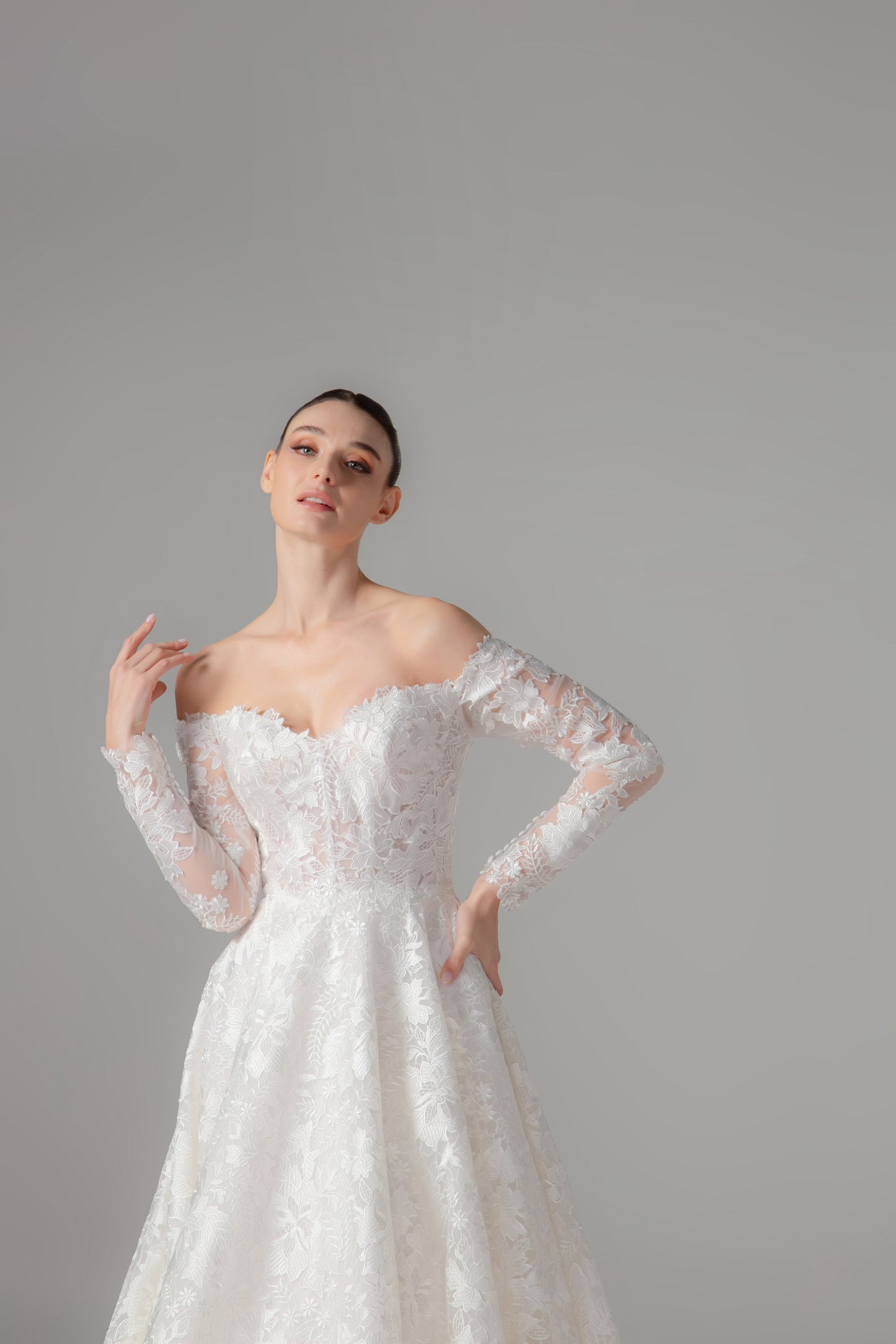 Off-the-Shoulder Long Sleeve Lace Ball Gown with Cathedral Train | Briderful - fabric detail