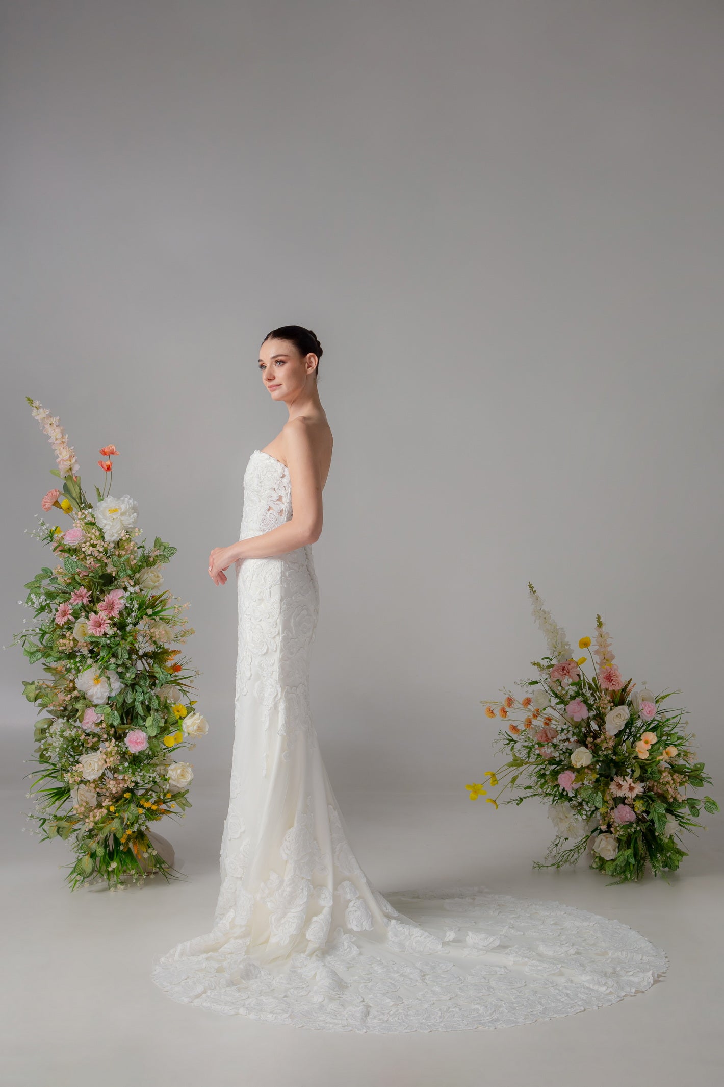 Deep V-Neck Trumpet Wedding Gown with Side Cutouts & Floral Lace | Briderful - side
